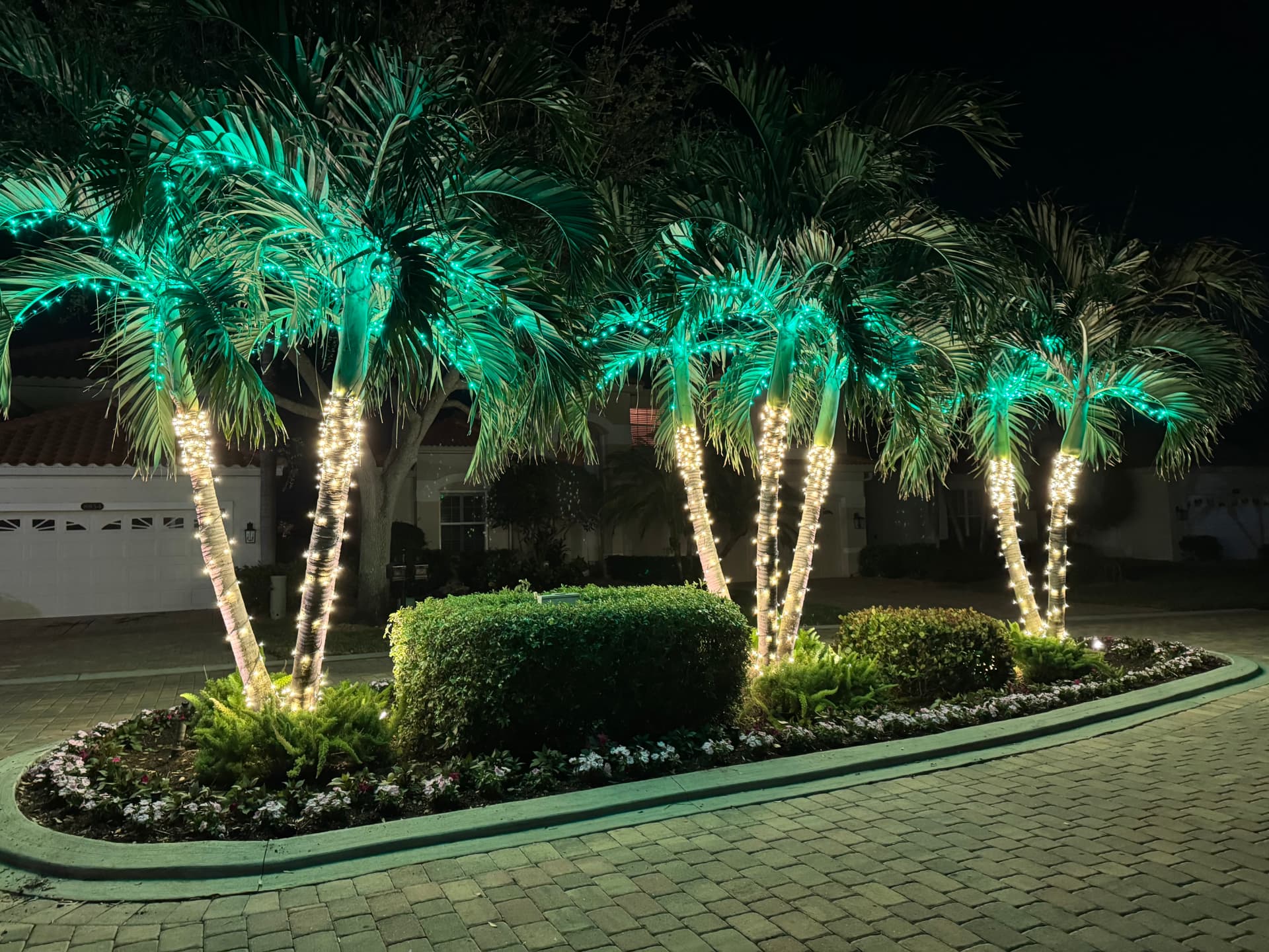 Beautifully lit Naples home at night